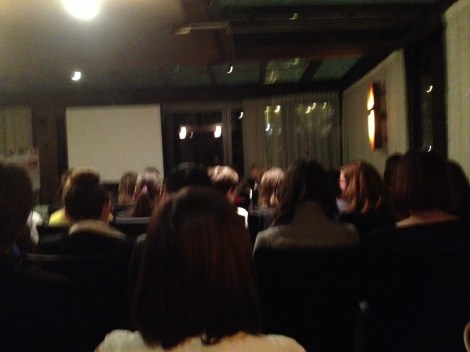 The panelists are up front. I wish they invested in a platform so I could see them talk.